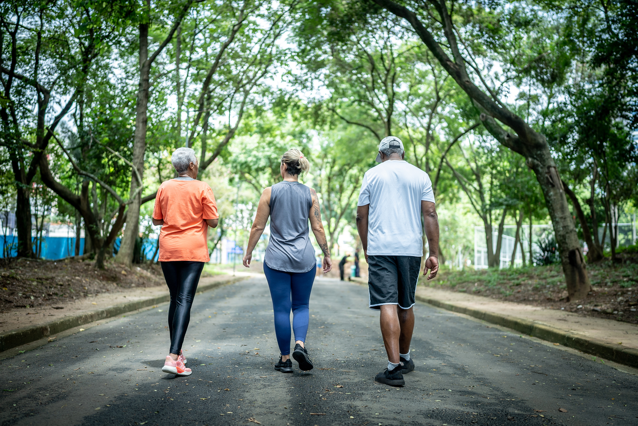 Older adult walking outdoors to improve circulation and manage peripheral artery disease